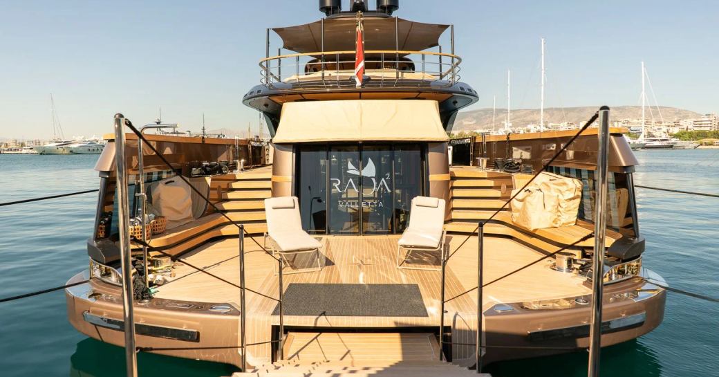 Overview of the swim platform and loungers onboard charter yacht RAJA²