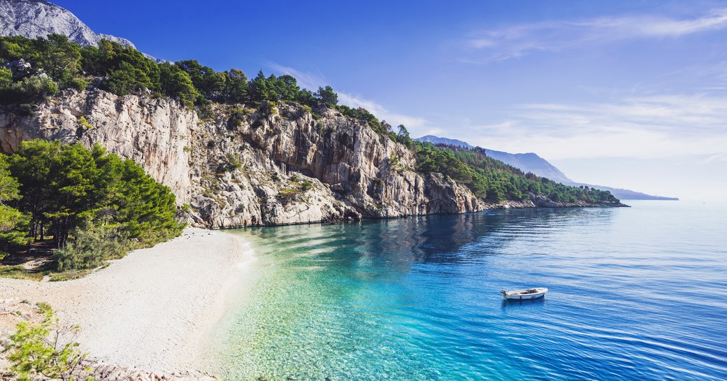 Cove in Sardinia with white sand beach and blue water