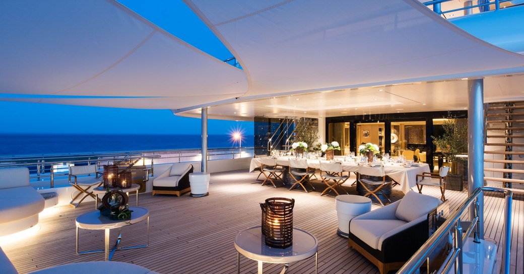 Alfresco dining set-up on superyacht ROMEA