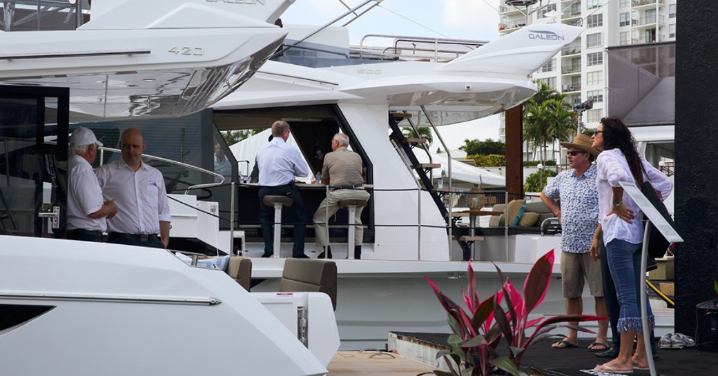 clients and dealers on board small production yacht at miami yacht show