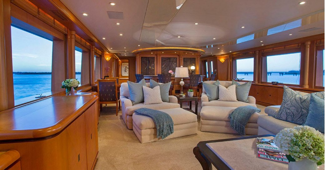 deep armchairs in the main salon of charter yacht SAVANNAH 