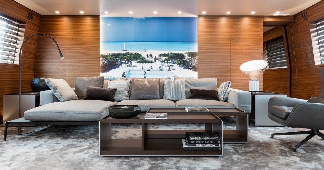 teak walls and seating area in the main salon on board superyacht ‘Silver Fast’ 