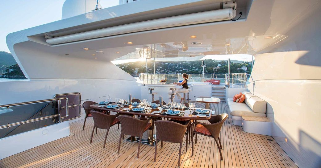 Sundeck dining area on luxury yacht DIANE