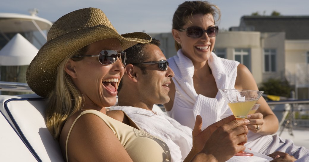 An attractive group enjoying drinks on a yacht