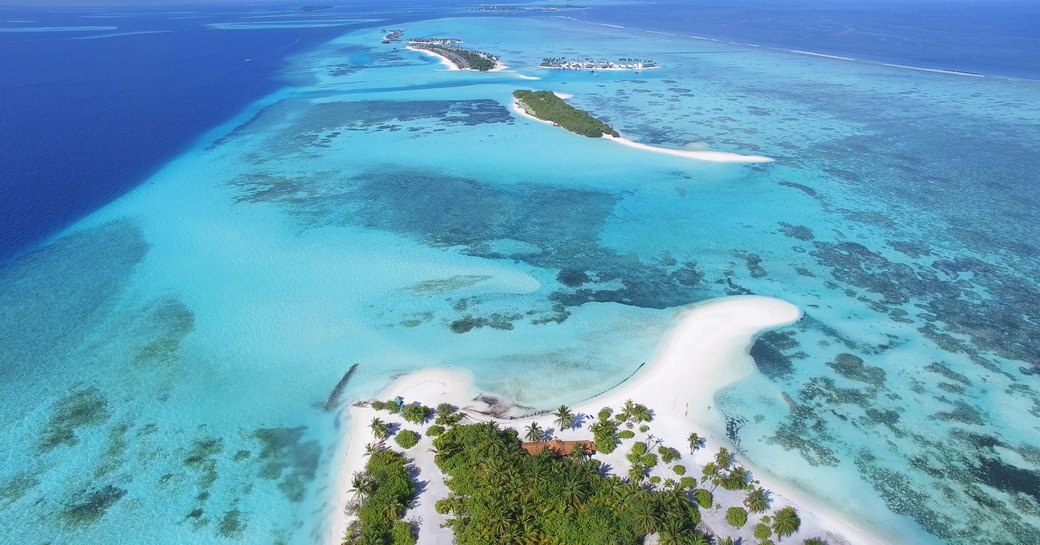 maldives aerial view, with sandy beaches and blue sea