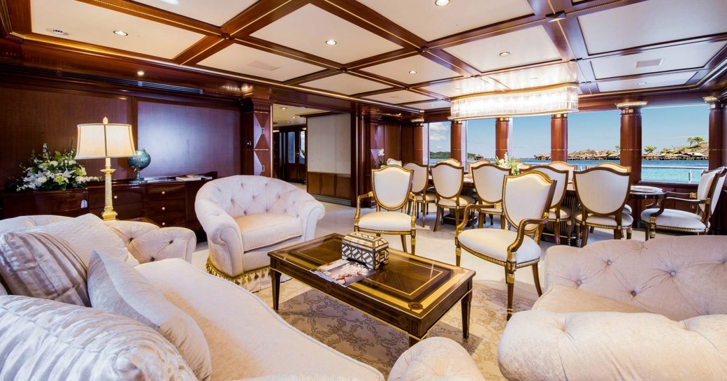 opulent main salon with fittings brushed in gold on board motor yacht My Seanna