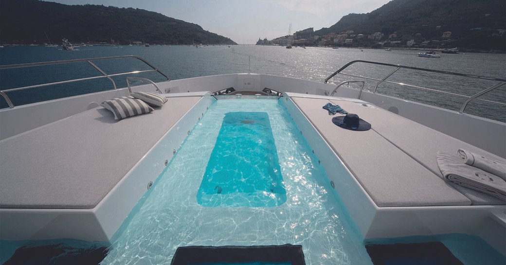 Luxury yacht MA on the foredeck, with sunpads either side