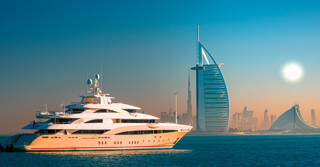 Burj Al Arab hotel in Dubai with motor yacht charter in the foreground