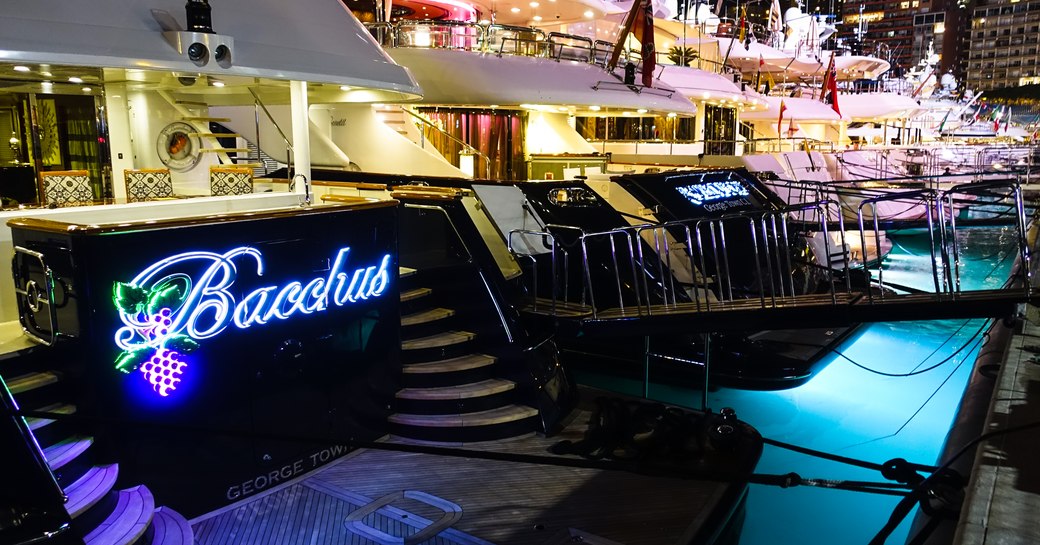 Charter yachts lined up in Port Hercules at night for the Monaco Grand Prix