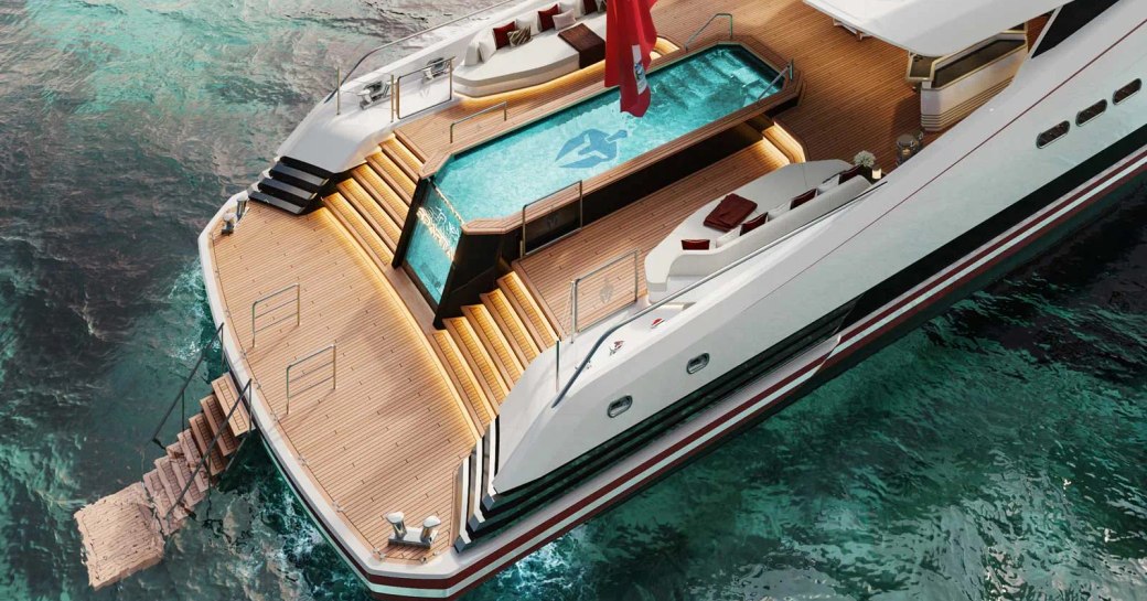 Overview of the aft deck onboard superyacht SPARTA, central swimming pool with steps leading down to the swim platform and a submerged ladder.