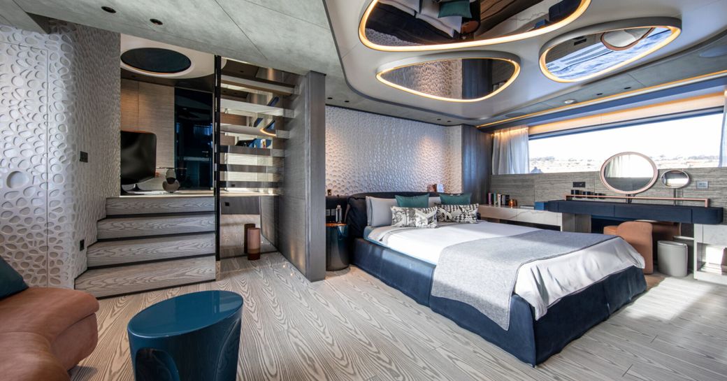 Master cabin onboard charter yacht PANDION PEARL with central berth and mirrors on ceiling