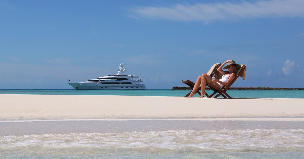 woman on isolated beach in the bahamas