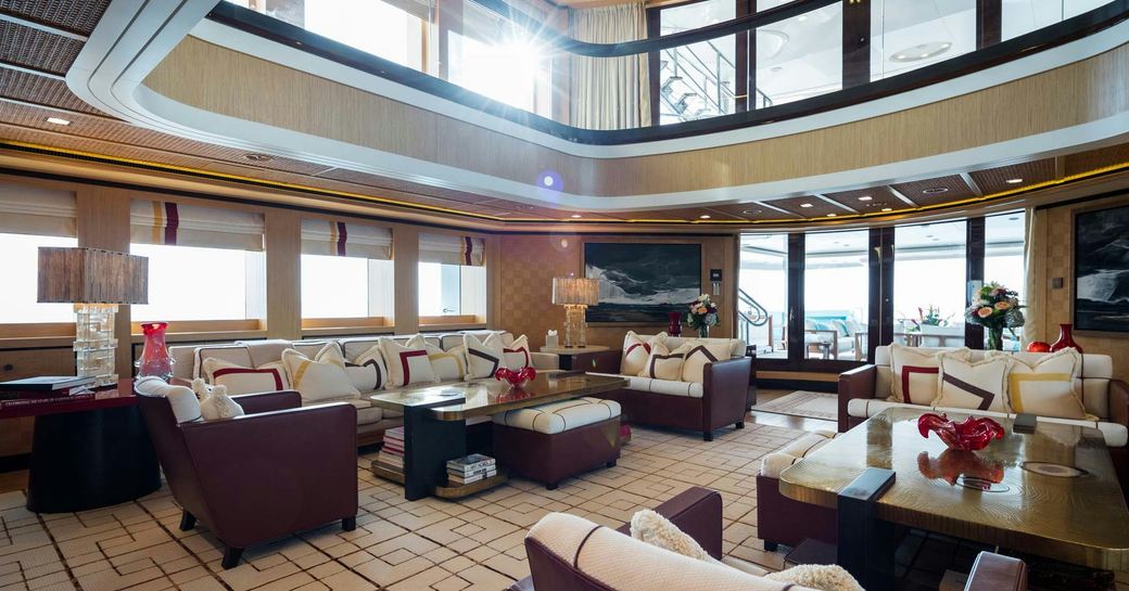 Main salon onboard charter yacht AXIOMA with plush seating and large windows