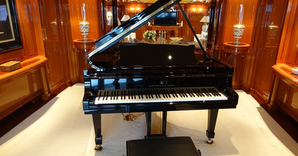 A sleek black piano on motor yacht Double Down