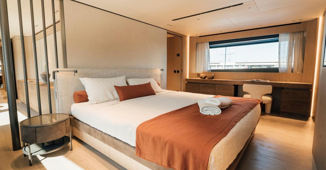 Guest cabin onboard with central berth onboard charter yacht ANDIAMO