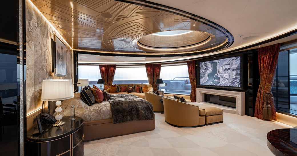 Master cabin onboard charter yacht KISMET with central berth and extensive windows