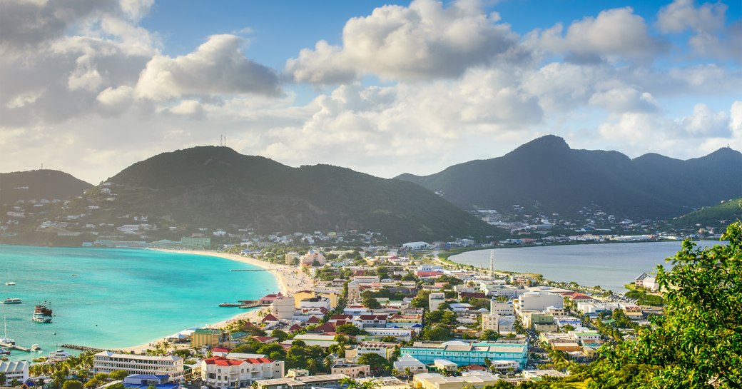 a small and colourful town lays between two bodies of water in the middle of saint martin 