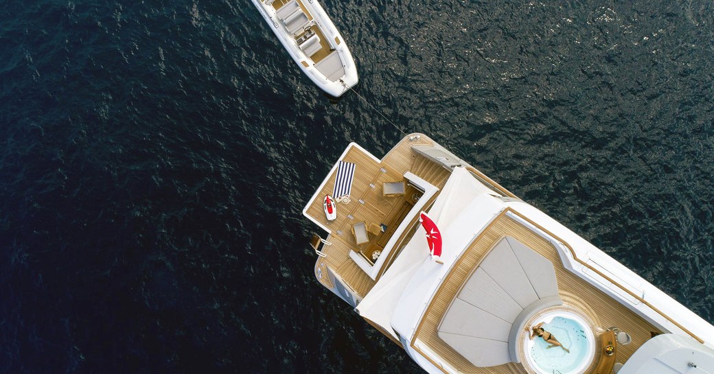 aft section of the sundeck aboard motor yacht CALYPSO with spa pool and sun pads