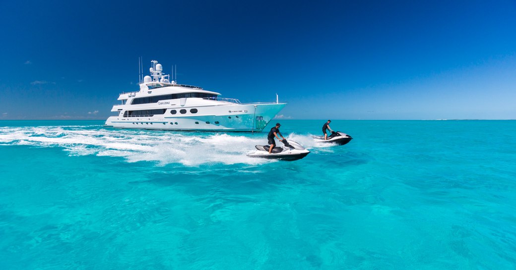 Superyacht cruising with two Jetskis