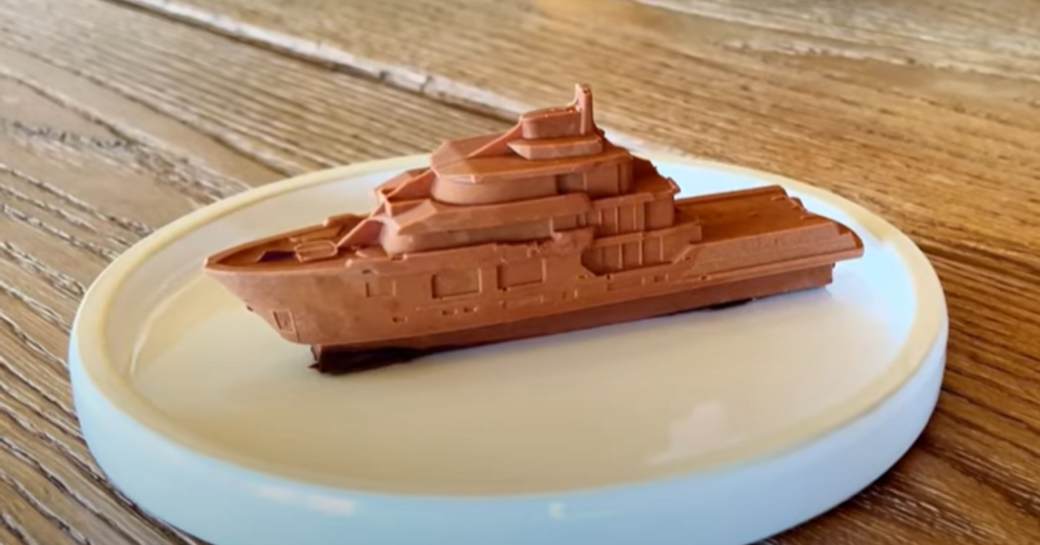 A hand crafted chocolate in the shape of private yacht charter KING BENJI