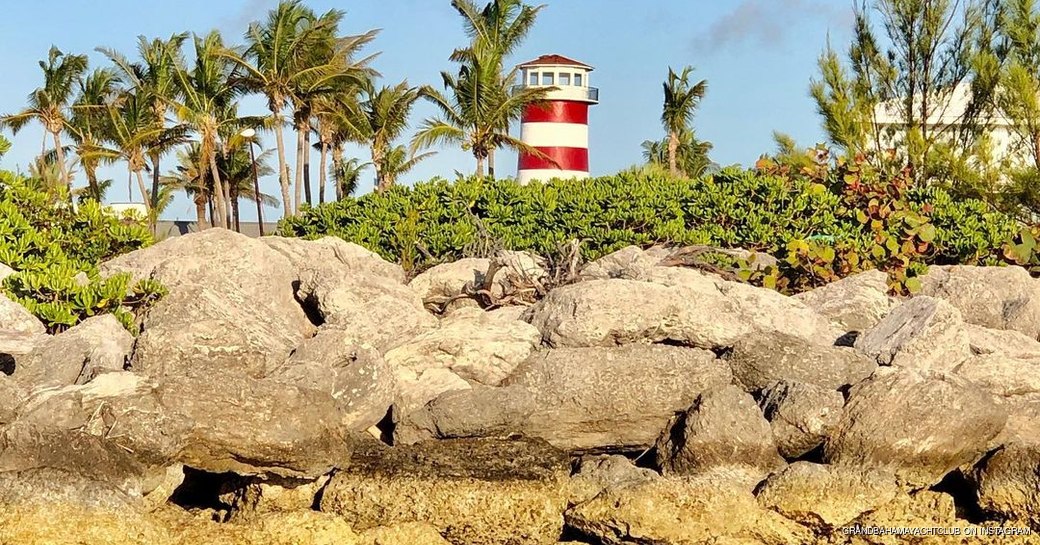 Freeport lighthouse sat behind rocks and trees