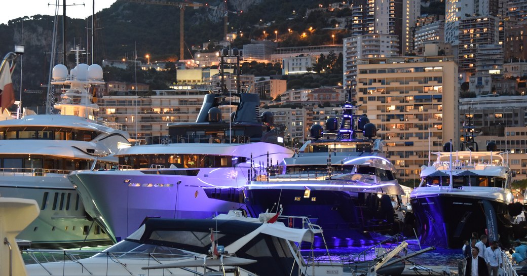 port hercules harbour by night, superyacht in line