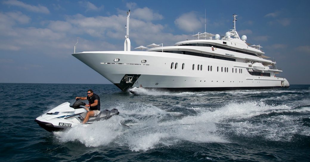 Charter yacht Moonlight II on water with tender