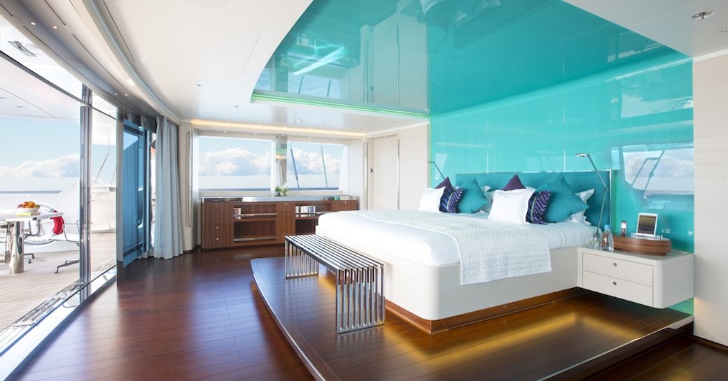 master cabin superyacht aquijo, with turquoise ceiling panels 