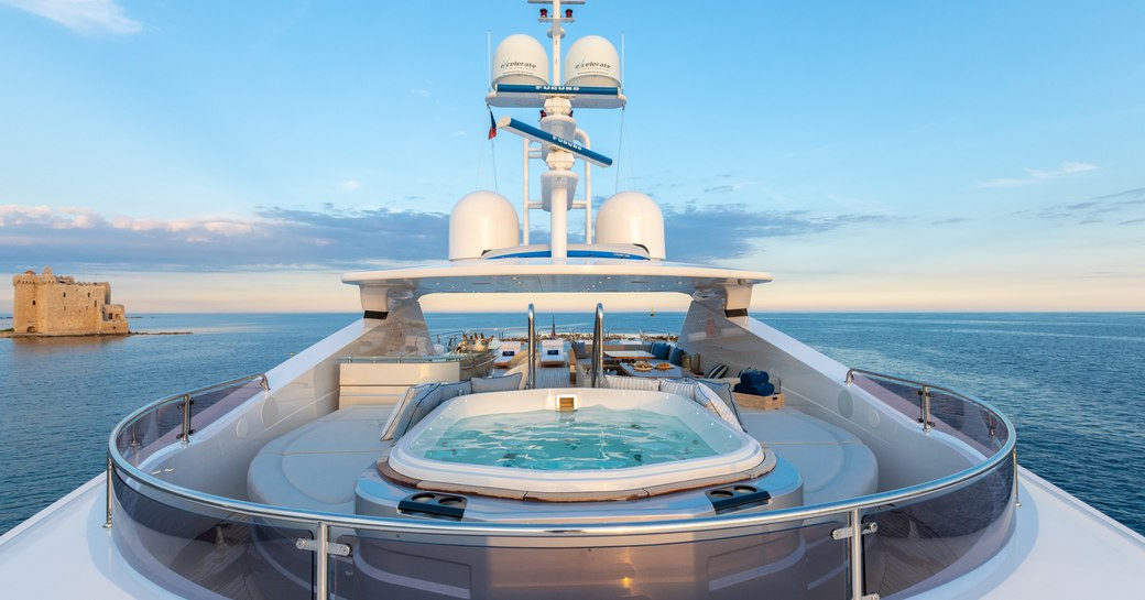 spa pool surrounded by seating on the sundeck of a superyacht