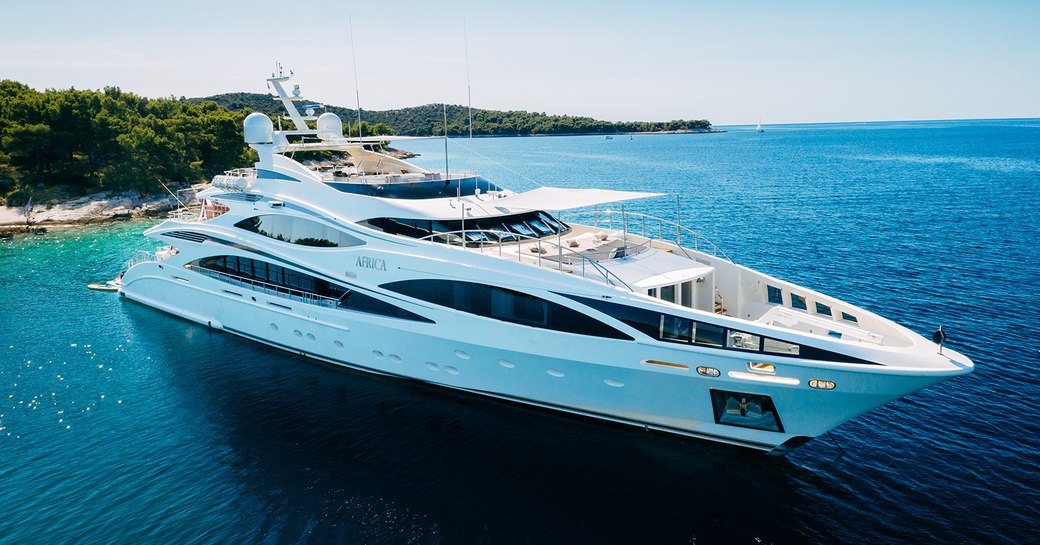 Charter yacht AFRICA I at anchor in a bay