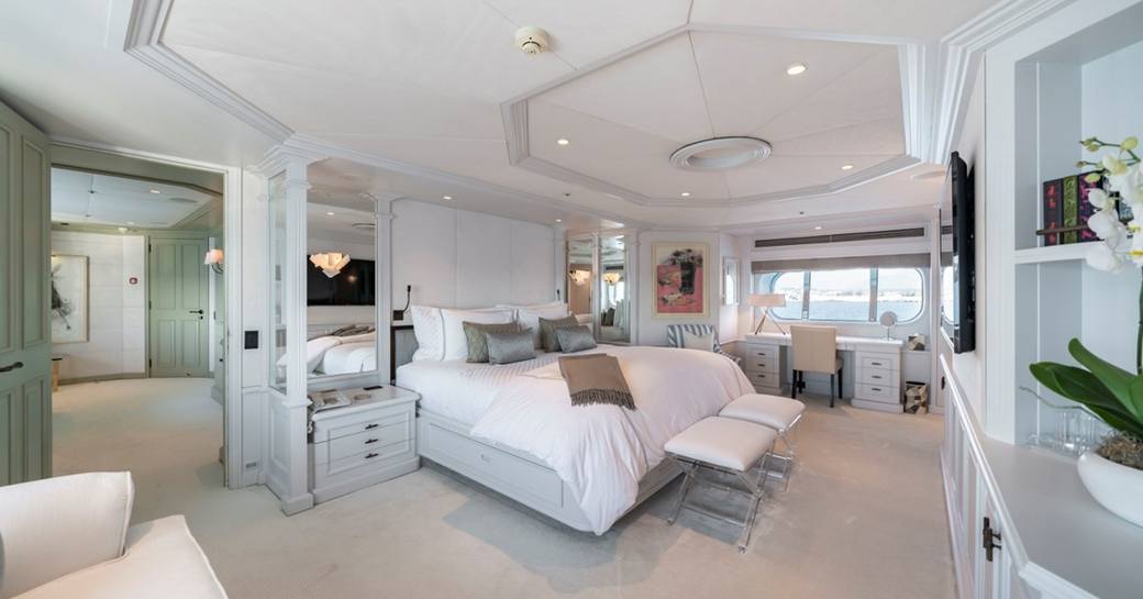 Overview of the master cabin onboard charter yacht MOSAIQUE, with central berth and large window