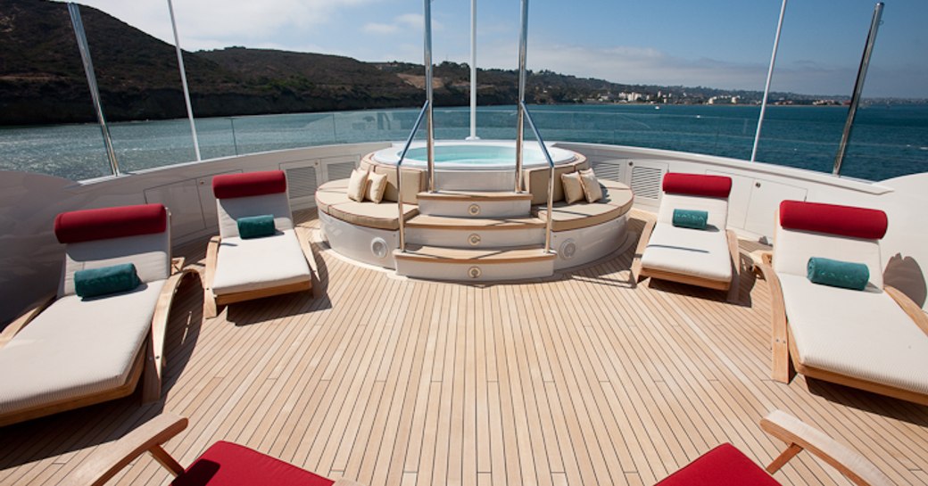 The jacuzzi and sunloungers placed on the sundeck of superyacht KATYA