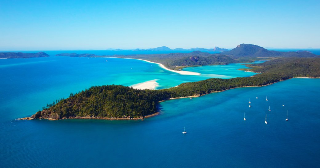 Luxury yachts at anchor in the Whitsunday Islands, Australia