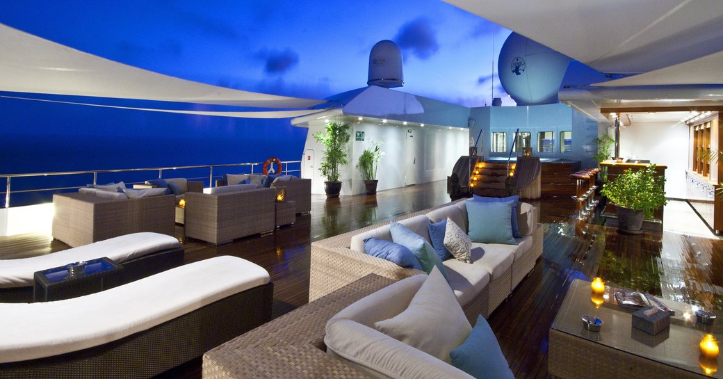 Al fresco dining space on sundeck on board motor yacht Lauren L