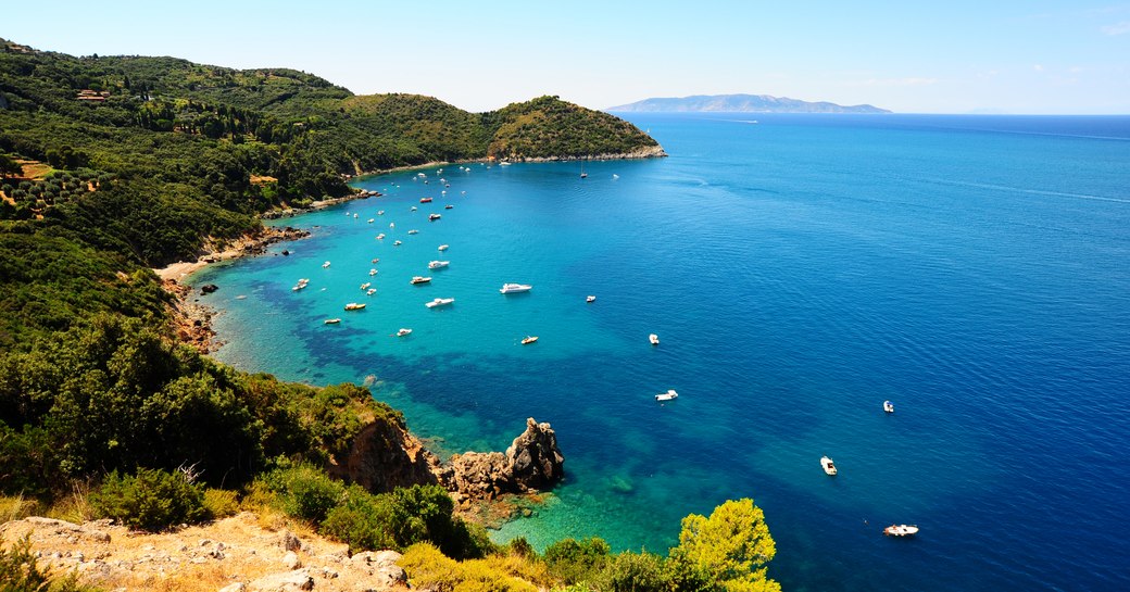 A Typical Italian Seascape With Hills And Indented Coastline