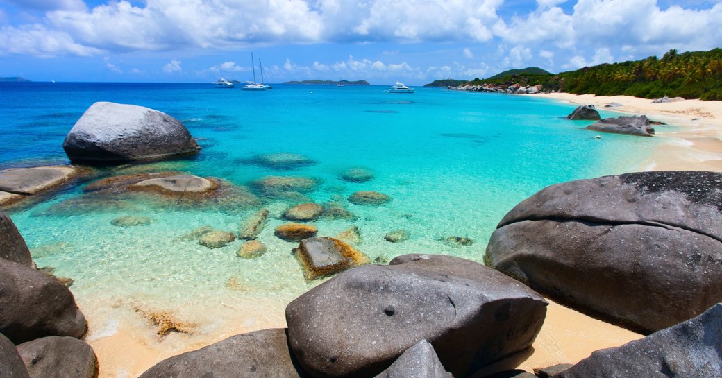 Caribbean beach with yachts in background