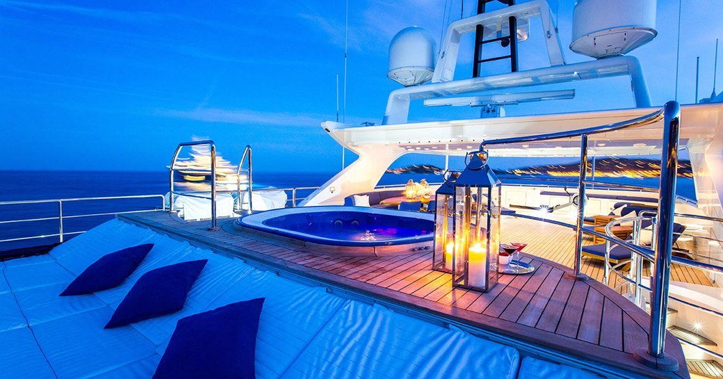 sundeck on board motor yacht MISCHIEF lights up at night