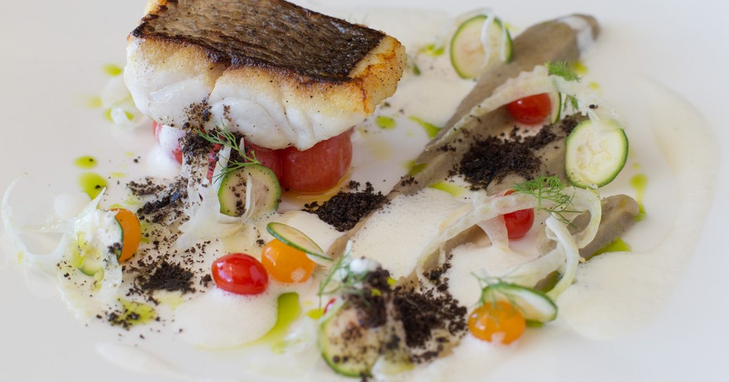 cuisine on superyacht, fish and white sauce 