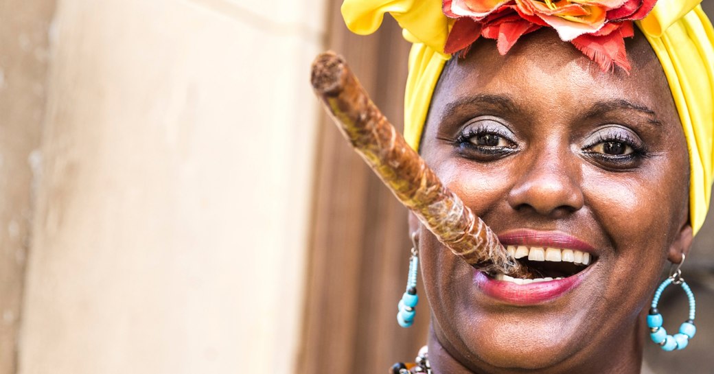 Lady smoking a Cuban cigar in Havana