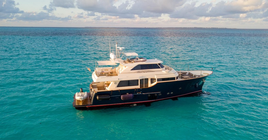 charter yacht NOMADA cruising the turquoise Caribbean sea on a blissful summer afternoon