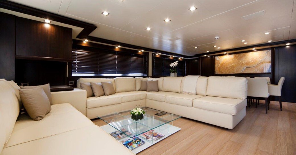 Superyacht GATSBY interiors - showing cream sofas and decked floor