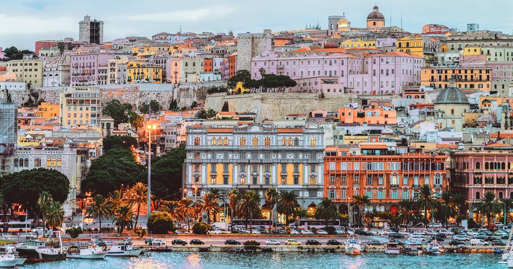 Houses along the waterfront in Sardinia at nightfall