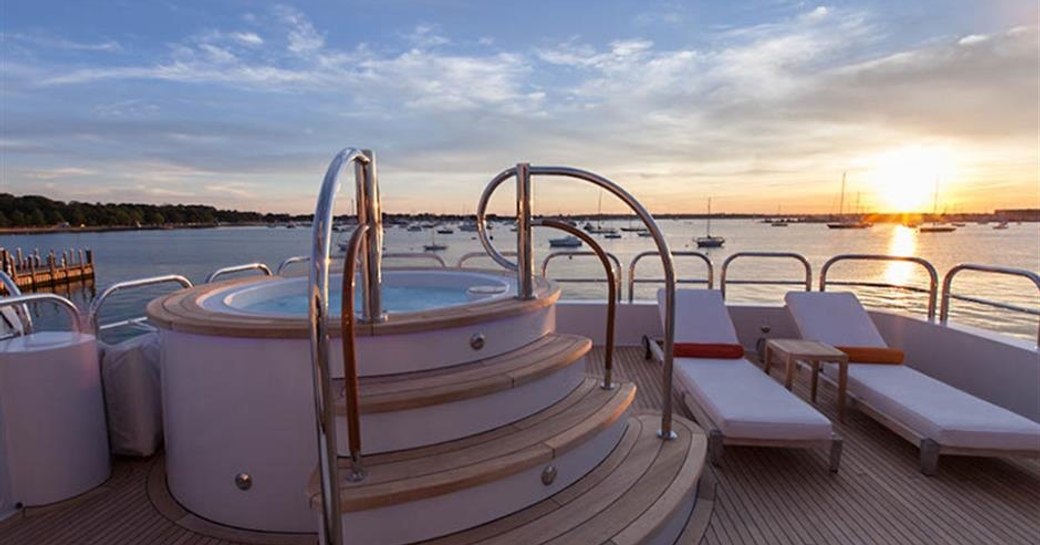 Jacuzzi and sunpads on sundeck of superyacht Aspen Alternative