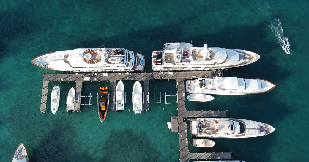 luxury superyachts at bay street marina during bahamas charter show