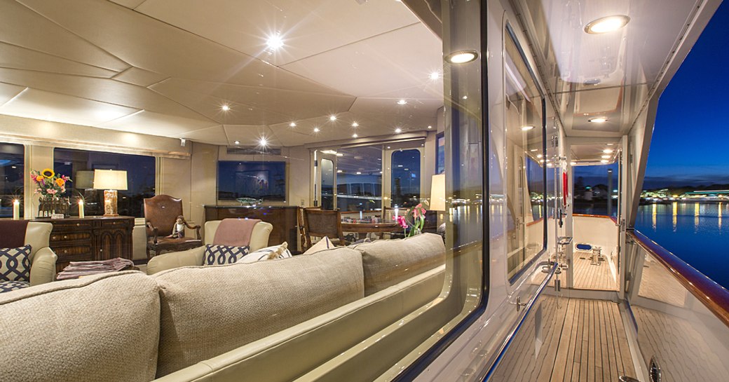 view of main salon of superyacht Sweet Escape from wrap-around deck