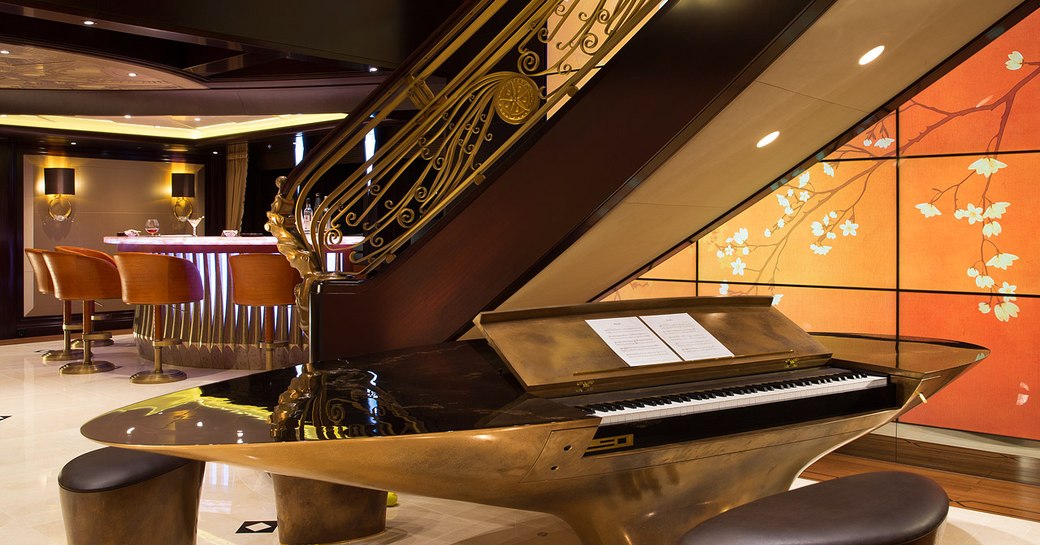 electric piano with video wall and bar on board motor yacht KISMET