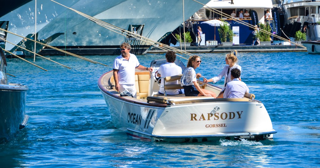 tender with show attendees cruising at monaco yacht show