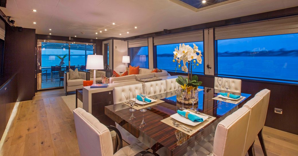 high-gloss dining table in main salon of superyacht ‘Lady Carmen’