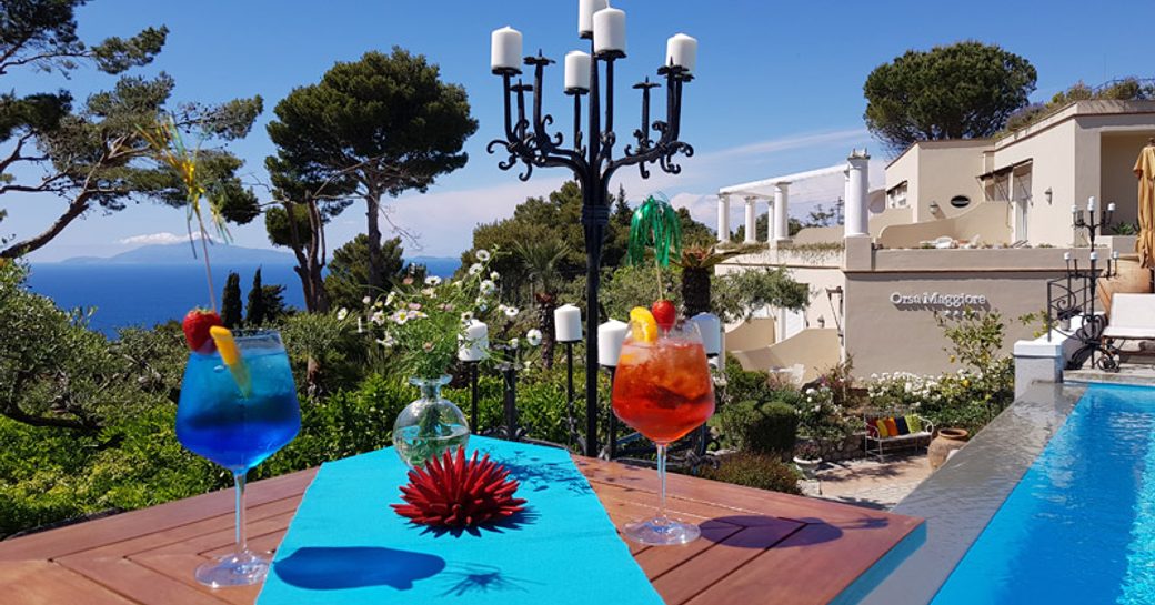 Cocktails at the poolside restaurant overlooking beautiful views of the Mediterranean