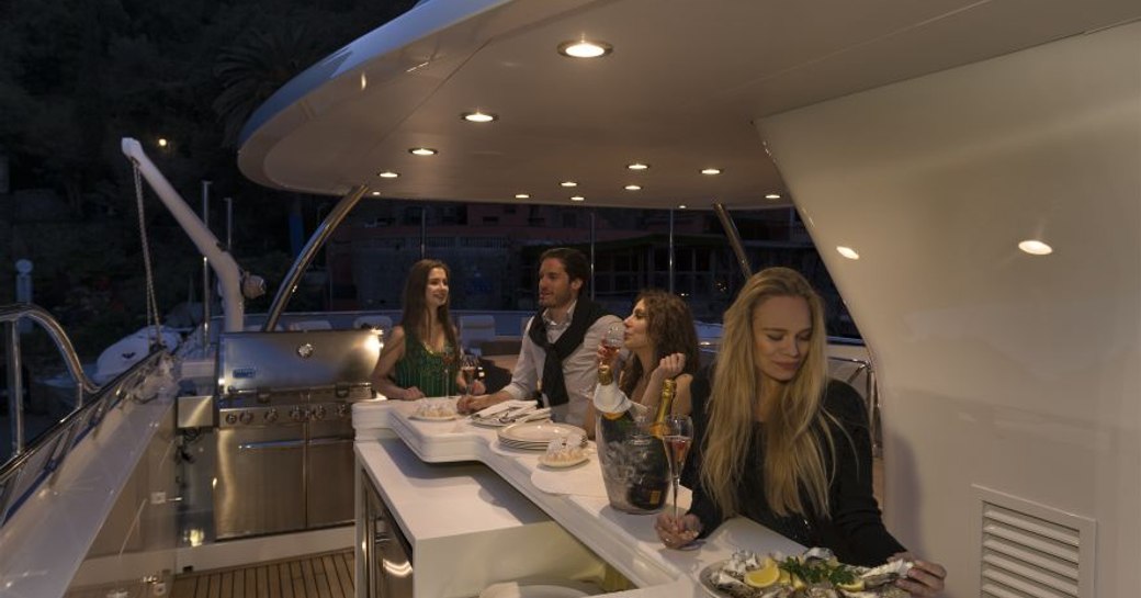 guests enjoying a decadent meal after a day of cruising mallorca on board charter yacht the wellington which is staring in the hit tv series below deck mediterranean 